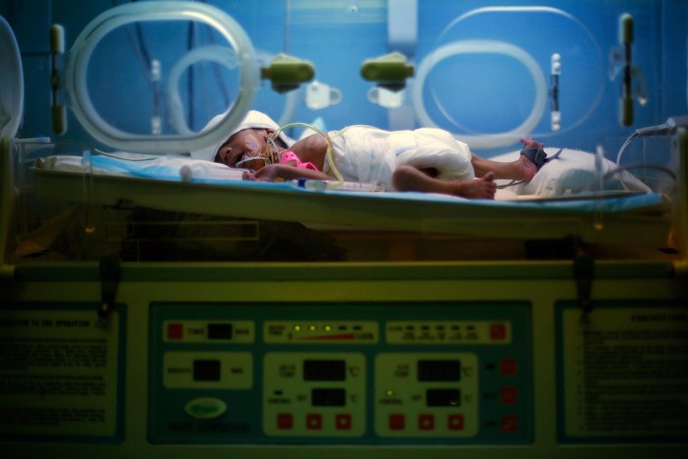 Image: A premature Syrian baby sleeps in an incubator at Chtaura's hospital in Chtaura, Lebanon