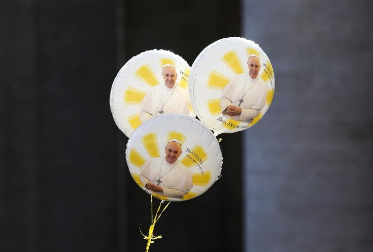 Balloons with the image of Pope Francis are seen during his Wednesday general audience in Saint Peter's square at the Vatican