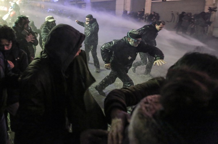 Image: Riot police use water cannons to disperse people protesting the death of Berkin Elvan