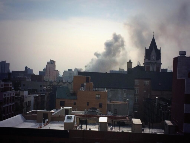 Smoke billows from a building in uptown Manhattan on March 12, 2014.