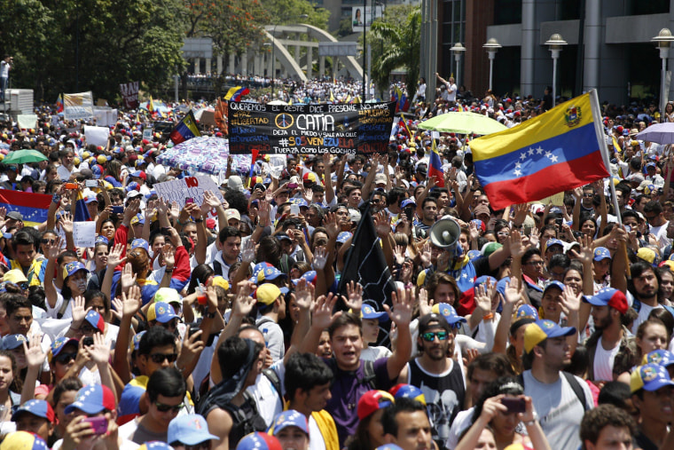 Image: Anti-government protesters march during a demonstration in Caracas