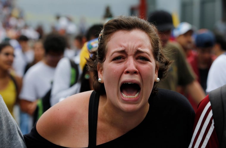 Image: A student of Venezuela's Central University shouts slogans against Venezuela's President Nicolas Maduro
