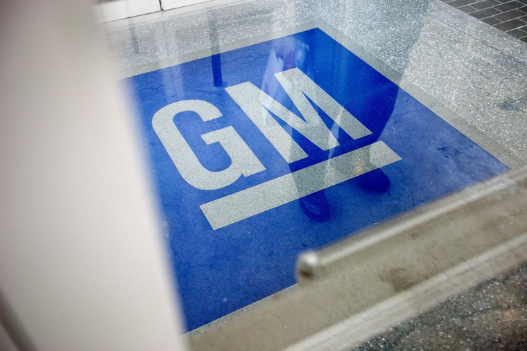 In this Thursday, Jan. 10, 2013 file photo, the logo for General Motors decorates the entrance at the site of a GM information technology center in Roswell, Ga.