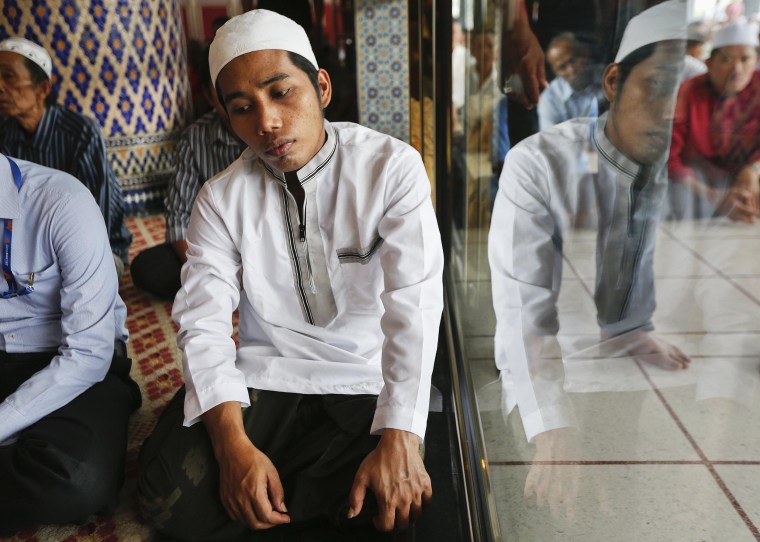 Image: Muslims pray during Friday prayers at National Mosque in Kuala Lumpur