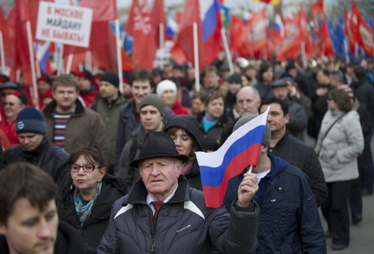 Image: Demonstrators march in support of Kremlin-backed plans for the Ukrainian province of Crimea to break away and merge with Russia, in Moscow