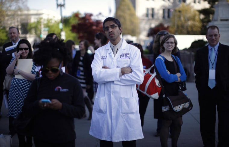 Image: Doctor Murthy stands outside the Supreme Court during legal arguments over the Affordable Care Act in Washington