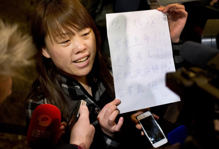 Image: A relative of a Chinese passenger aboard the missing Malaysia Airlines Flight 370