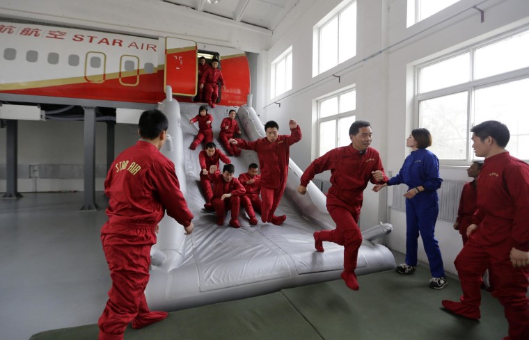 Image: Trainees practice emergency evacuation on the outskirts of Beijing