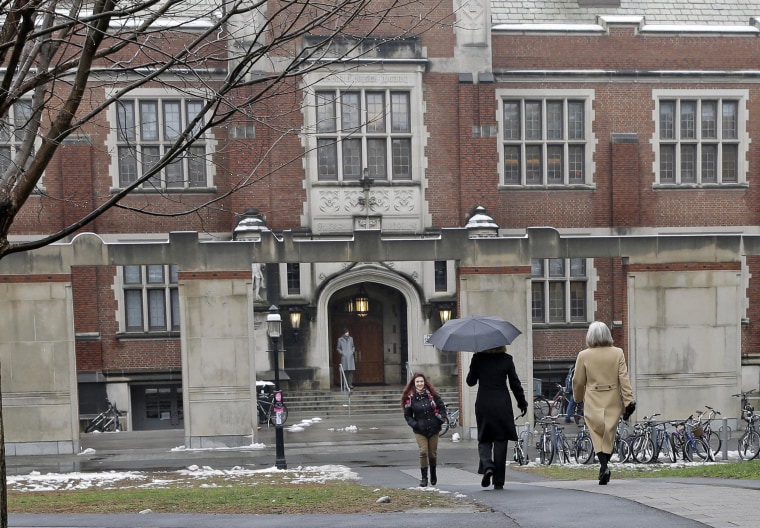 People walk on the campus of Princeton University on Dec. 9, 2013, where the Ivy League school was vaccinating nearly 6,000 students to try to stop an outbreak of type B meningitis.