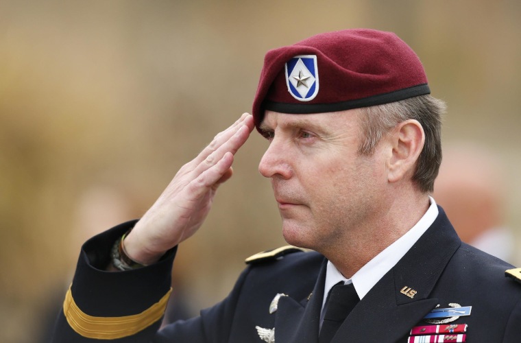 U.S. Army Brigadier General Jeffrey Sinclair salutes as the flag is lowered for the day after leaving the courthouse at Fort Bragg in Fayetteville, North Carolina March 18, 2014. 