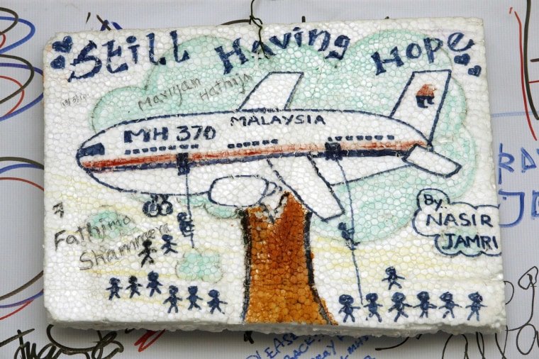 Image: An artwork conveying well-wishes for the missing Malaysia Airlines Flight MH370 is seen in Kuala Lumpur International Airport