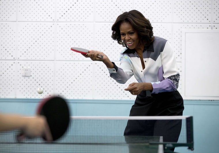 Image: First Lady Michelle Obama plays table tennis