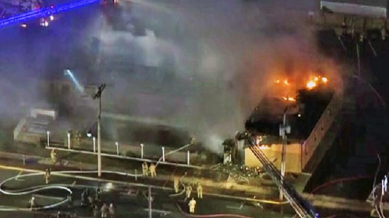 Firefighters work at the scene of a fatal fire at a Jersey shore motel Friday morning.