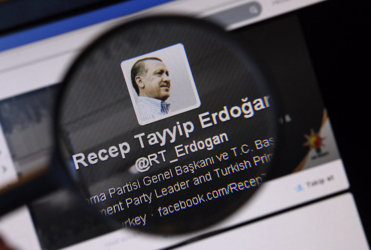 Image: An image of Turkish Prime Minister Erdogan on a twitter account is pictured through a magnifying glass in this illustration picture taken in Istanbul