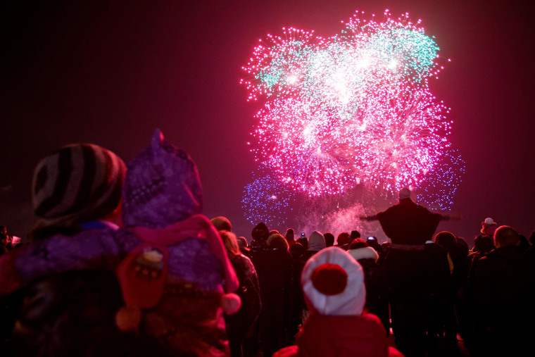 Image: Fireworks illuminate the sky marking the incorporation of the Black Sea peninsula, Crimea, into Russia in Moscow