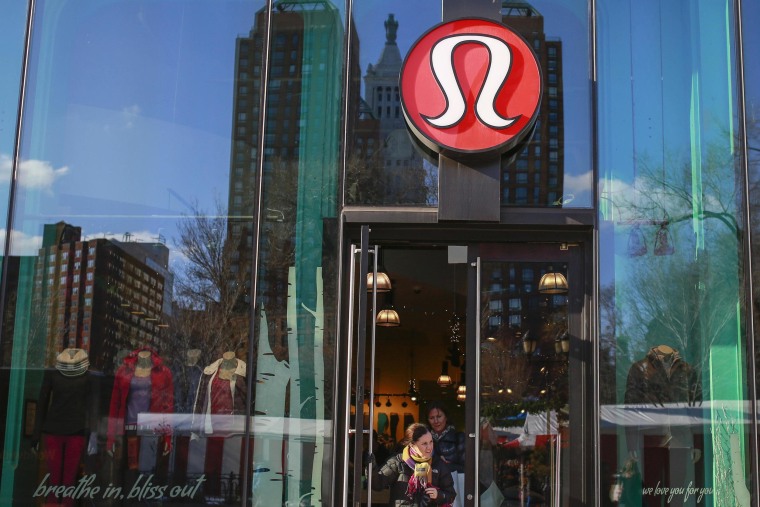 Image: A shopper walks out of the Lululemon Athletica store in New York