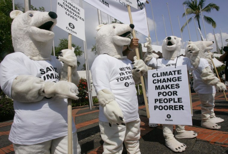 Oxfam activists wearing polar bear costumes stage a demonstration outside the venue of the U.N. climate change conference