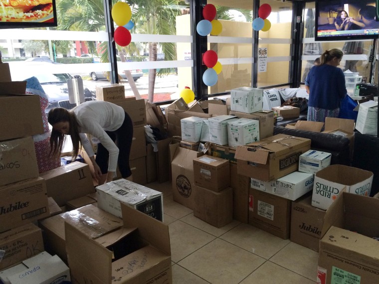 Image: Medical supplies donations are packed for shipment at “El Arepazo” restaurant in Doral, Fla.