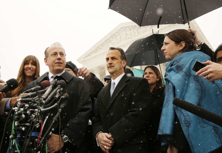 Image: Clement speaks to the press next to Cortman on the steps of the Supreme Court in Washington