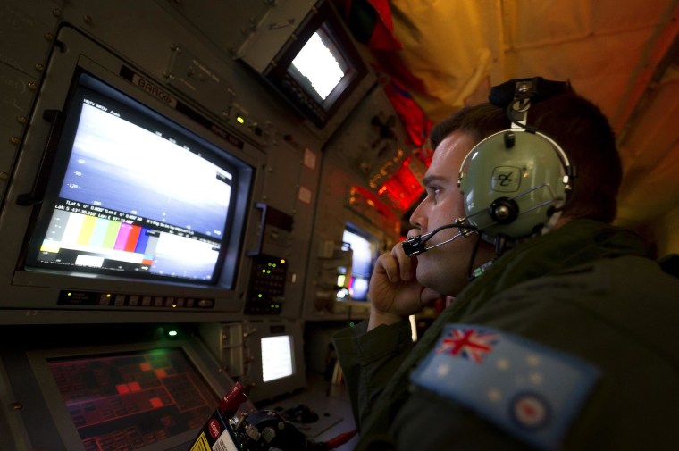 Image: An AAF airborne electronics analyst uses the advanced camera system during the search for missing Malaysian Airlines Flight MH370