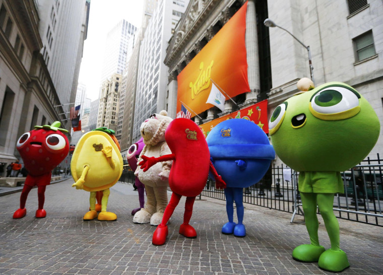 Mascots dressed as characters from the mobile video game "Candy Crush Saga" pose outside the New York Stock Exchange.