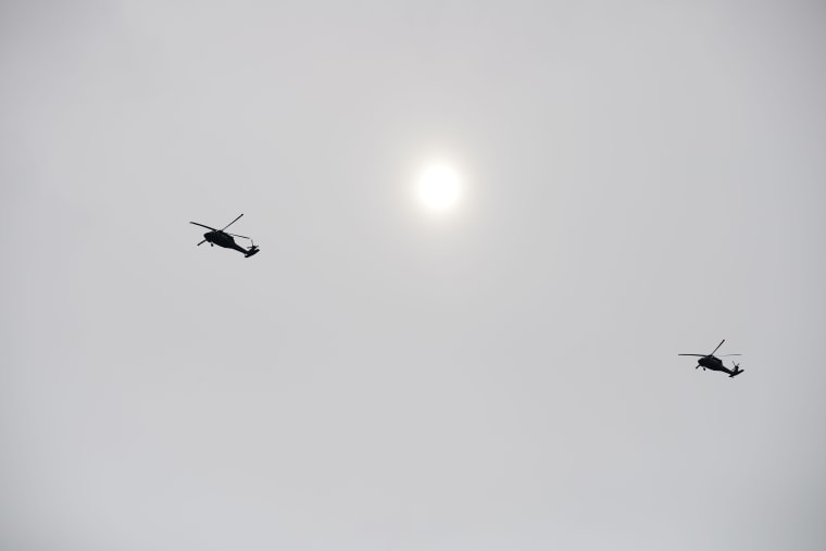 Helicopters flying over Oso on Wednesday heading for the disaster scene.