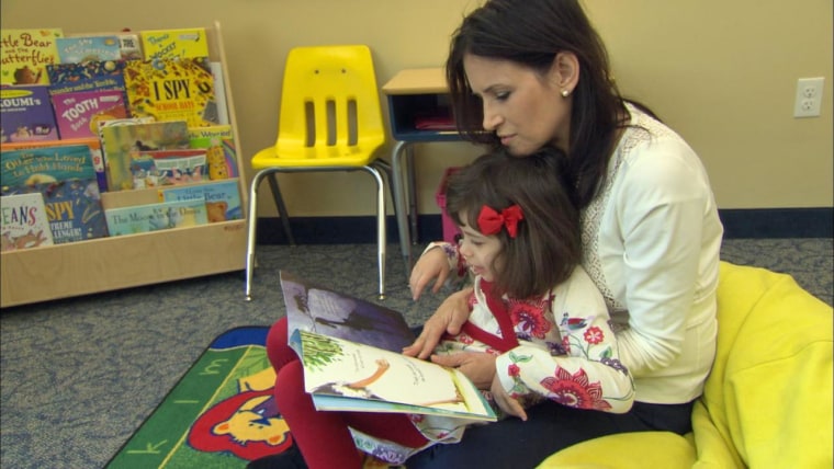 Kim Cristo reads with her daughter Ava, age 6, who attends Reed Academy in Oakland N.J. Ava has autism and was diagnosed at 18 months. New CDC statistics show that 1 in 68 kids has autism, and doctors stress it’s important to get children diagnosed as early as possible so they can get therapy.