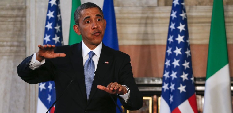 Image: U.S. President Obama gestures during a joint news conference with Italian Prime Minister Renzi at the end of a meeting at Villa Madama in Rome