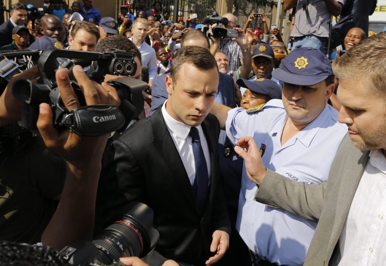 Image: South African Paralympic athlete Oscar Pistorius leaves court