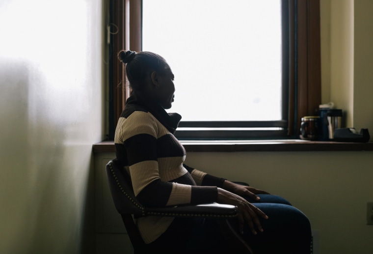 "Marie," a victim of Female Genital Mutilation, sits for a portrait with her face hidden to protect her identity at Sanctuary for Families in New York, on March 18, 2014.