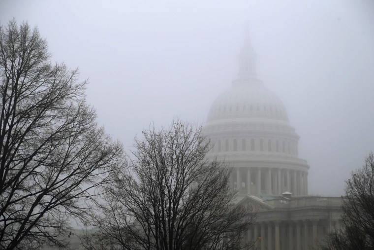 Image: Morning mist covers the U.S. Capitol dome in Washington
