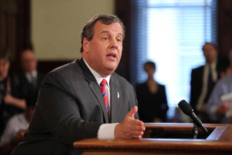 Image: New Jersey Governor Chris Christie talks to reporters in the New Jersey State House in Trenton, N.J.