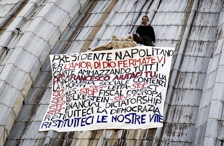 Image: Italian businessman Marcello Di Finizio protests on St Peter's basilica