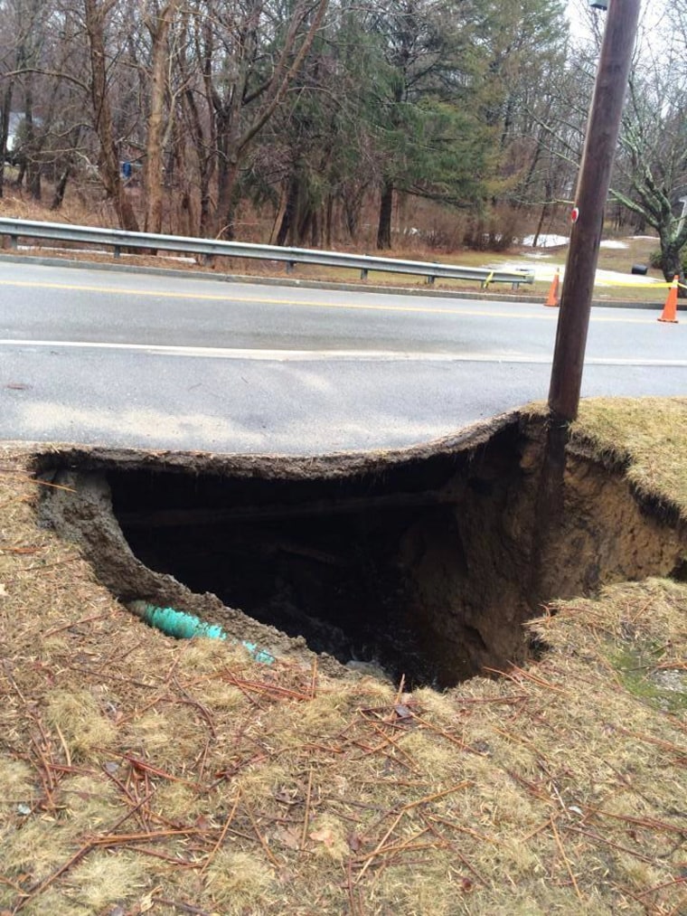 Severe flooding on Sunday caused a sinkhole that impacted a telephone line and resulted in road closures in Chelmsford, Mass., 30 miles north of Boston.