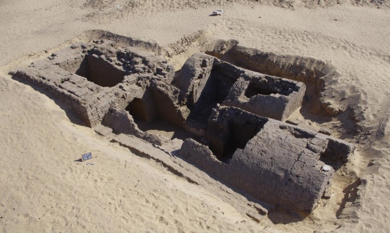 Dating back around 3,300 years, this tomb was discovered recently at an ancient cemetery at Abydos in Egypt. At left is a rectangular entrance shaft with massive walls that served as the base for a pyramid thought to have risen 23 feet (7 meters) in height.