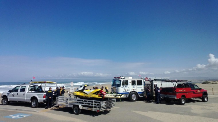 Rescue teams gather to search the Guadalupe Dunes Park on March 31, 2014 for a man who was pulled into the surf Sunday during a baptism ceremony.