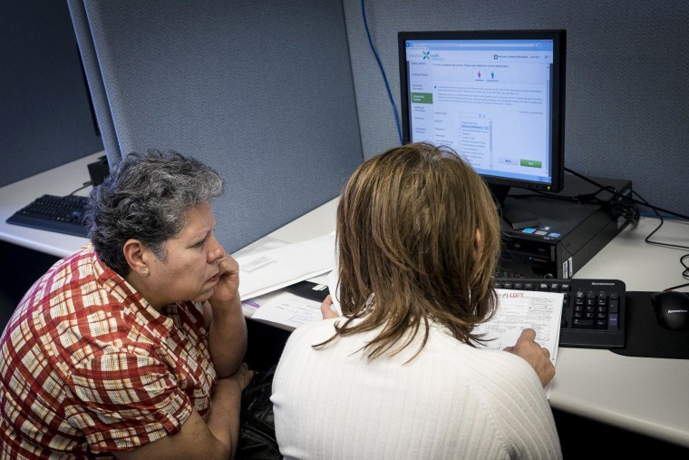 Healthcare Navigator Carolina Orozco (right) assists Ava Esteban, 55, of Hyattsville, MD as she attempts to sign up for healthcare insurance through the Maryland Health Connection Exchange at the Montgomery County Department of Health and Human Services in Silver Spring Maryland on Monday March, 31.