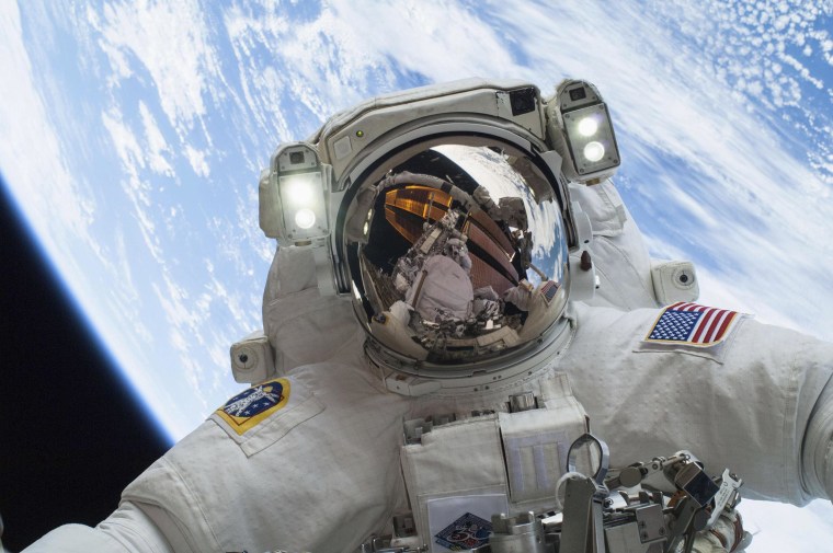 Image: Astronaut Mike Hopkins participates in a spacewalk.