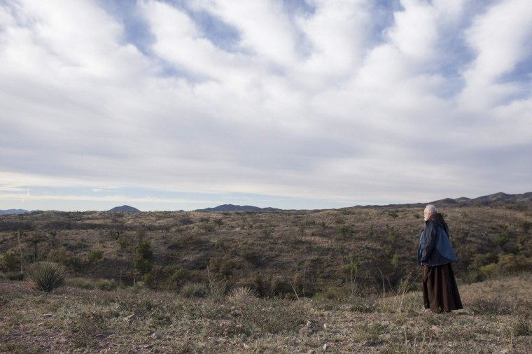 Image: Cardinal Sean O'Malley of Boston walks the Arizona desert similar to where migrants cross the U.S.-Mexico border near Nogales Arizona