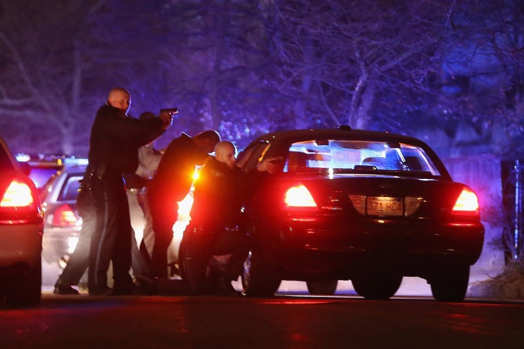 Image: Police search for suspects in Watertown, Mass.