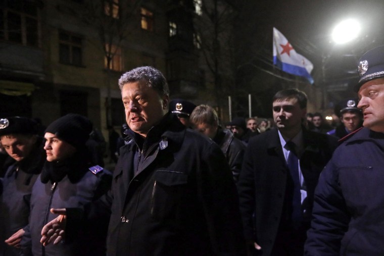 Image: Ukrainian parliament member Petro Poroshenko leaves Crimea's parliament building