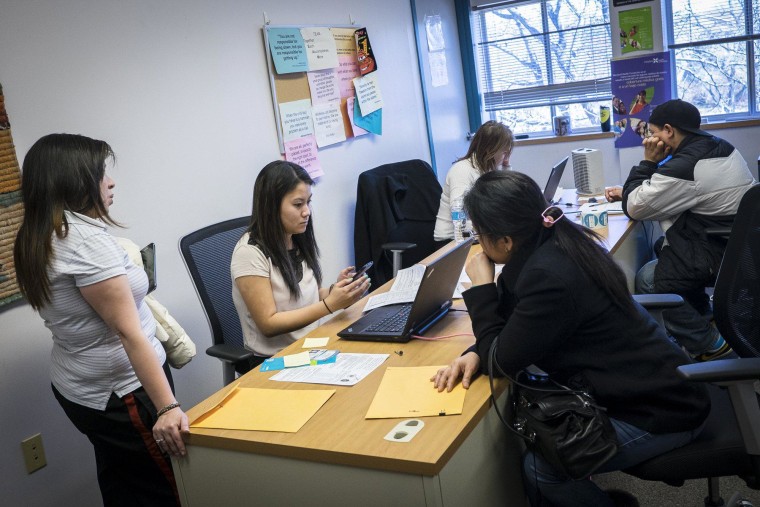 Healthcare navigators assist customers as they try to sign up for health insurance at The Montgomery County Department of Health and Human Services in Silver Spring Maryland on March 31.