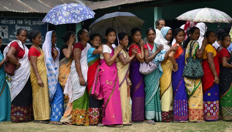 Image: Voters line up in India's Lakhimpur district on Monday