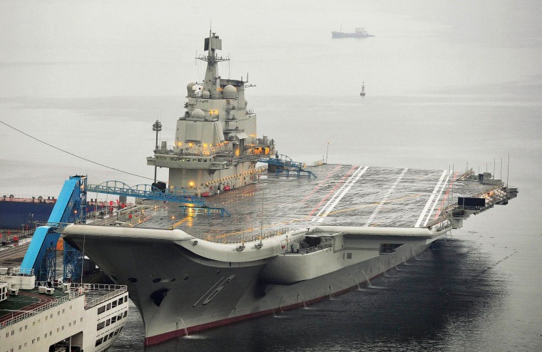 Image: China's first aircraft carrier docked at Dalian Port, in Dalian, Liaoning province