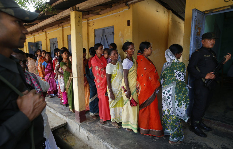 Image: Women wait to cast ballots in Agartala, India