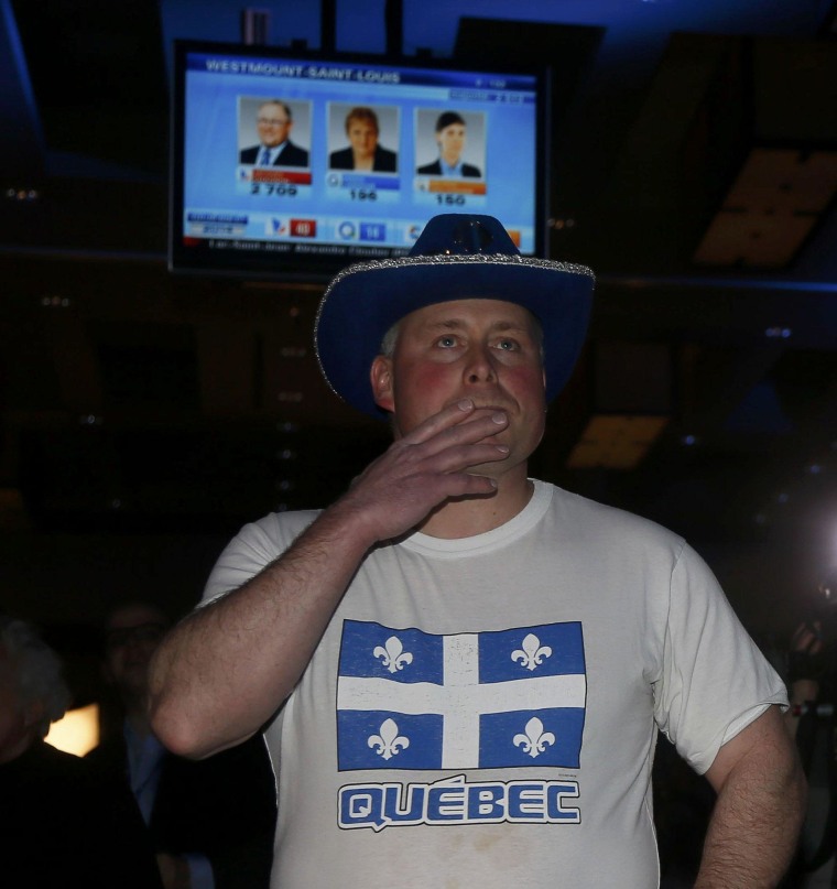 Image: A Parti Quebecois supporter watches results on Monday