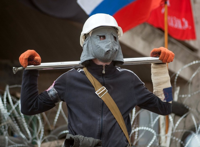 Image: A pro-Russian protester attends a rally in Donetsk.
