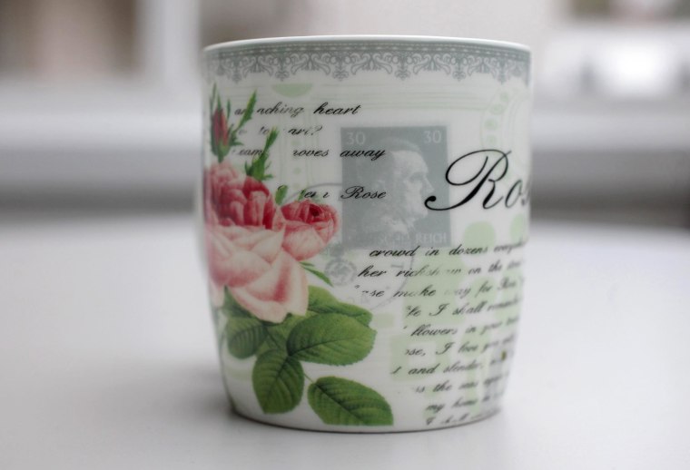 Image: A mug with a print of a faded stamp with a portrait of Nazi dictator Adolf Hitler