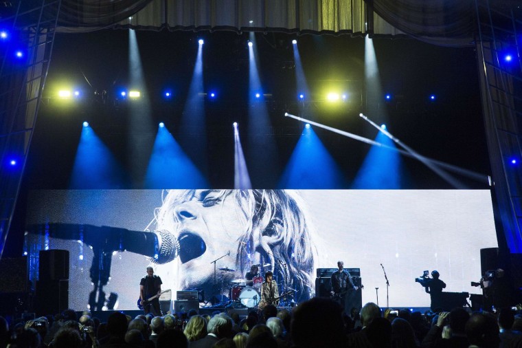 Image: Singer Jett performs with remaining members of band Nirvana