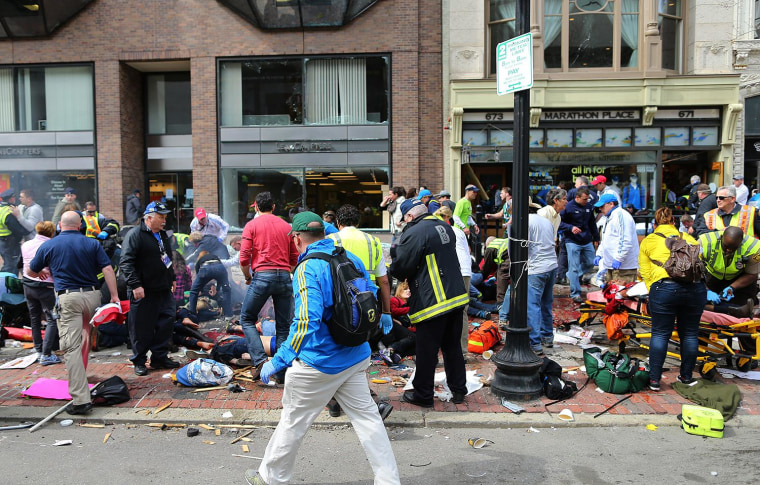 Image: First responders aid those injured by the Boston Marathon bombing